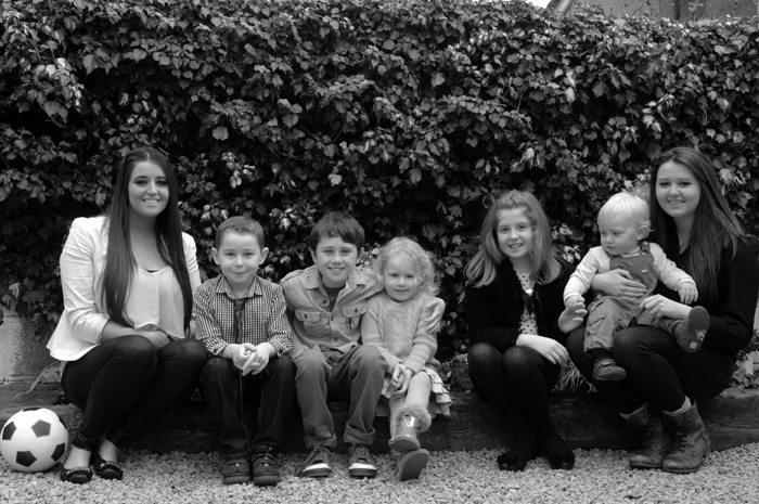 Portrait of grandchildren in back garden