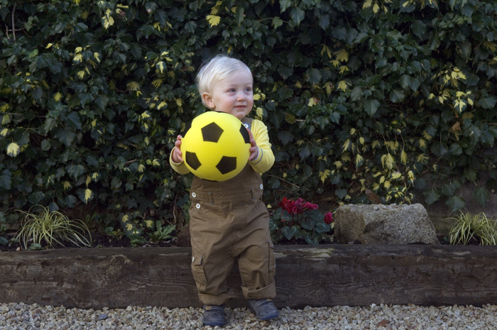 Portrait of little boy with football