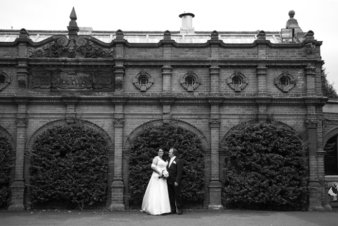 The bride and groom photographed by the Historic Roberts house at Dublin Zoo