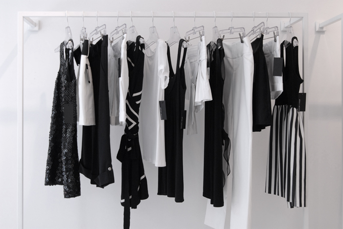 Photograph of dresses hanging on a rail