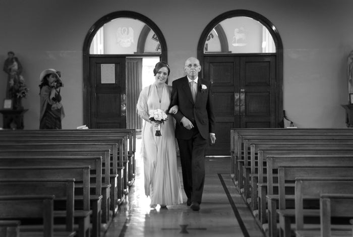 The bride walks up the aisle with her father at Mount Argus Church in Dublin
