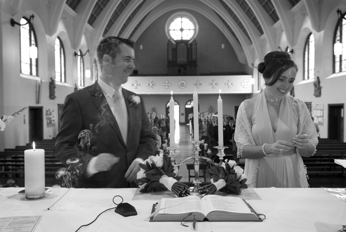The bride and groom light their wedding candle at Mount Argus Church in Dublin