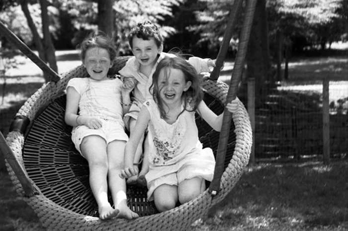 Portrait of Children Playing On Swing