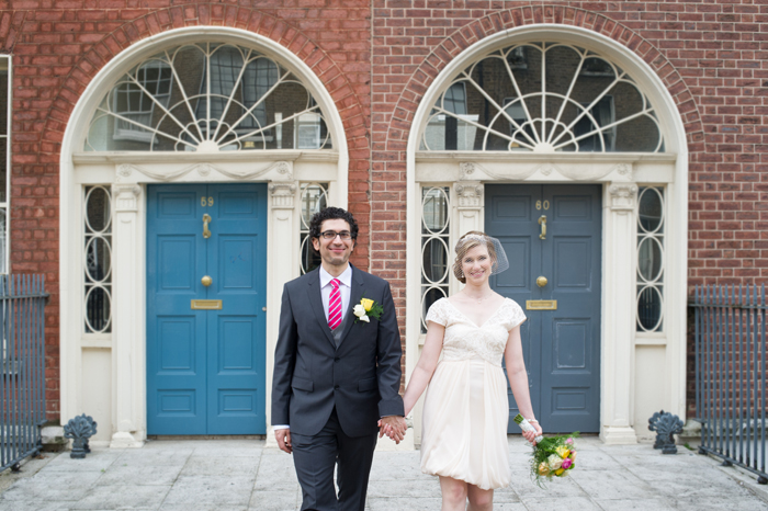 Portrait of the bride and groom in front of Georgian Doors