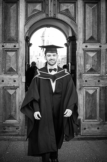 A graduation photograph at the front door of Trinity College Dublin